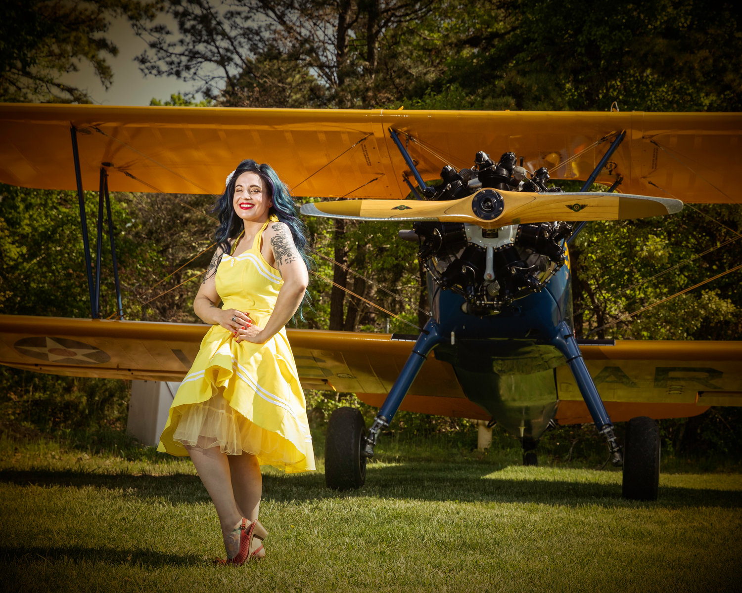 A fixture of the ubiquitous pinup fandom on Long Island, Rosie Casaceli poses with a 1940s airplane to set off her vintage wardrobe piece